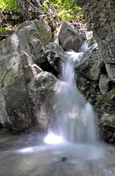 WET SPRING Soda Springs Creek flows into summer, cascading over large boulders into lots of sweet little pools. - PHOTO BY CAMILLIA LANHAM