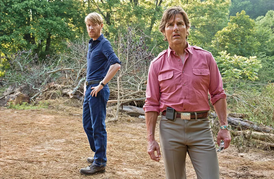 THE CIA AND THE RUBE CIA handler Monty Schafer (Domhnall Gleeson, left) recruits pilot Barry Seal (Tom Cruise) into working for the CIA in reconnaissance, gunrunning, and worse. - PHOTO COURTESY OF UNIVERSAL PICTURES