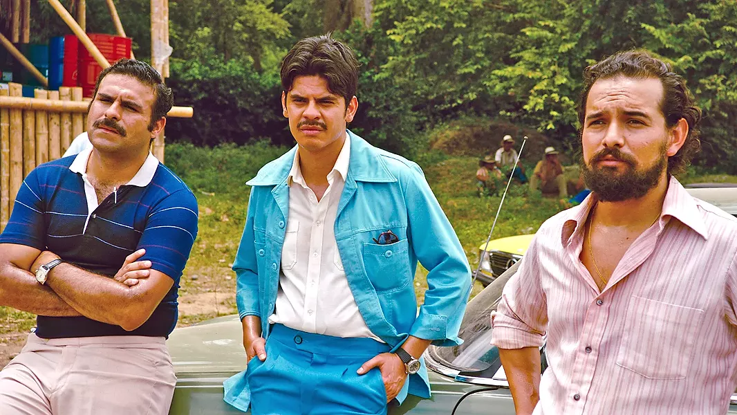 BUSINESSMEN (Left to right) Pablo Escobar (Mauricio Mejía), Carlos Ledher (Fredy Yate Escobar), and Jorge Ochoa (Alejandro Edda)—founders of the Medellín drug cartel—use Barry Seal to run drugs into the U.S. - PHOTO COURTESY OF UNIVERSAL PICTURES