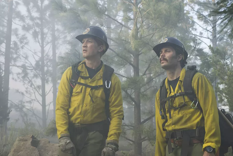 BROTHERHOOD Though at first at odds with one another, new crewmember Brendan McDonough (Miles Teller, left) bonds with veteran Christopher MacKenzie (Taylor Kitsch, right), in the wildfire drama Only the Brave. - PHOTOS COURTESY OF BLACK LABEL MEDIA