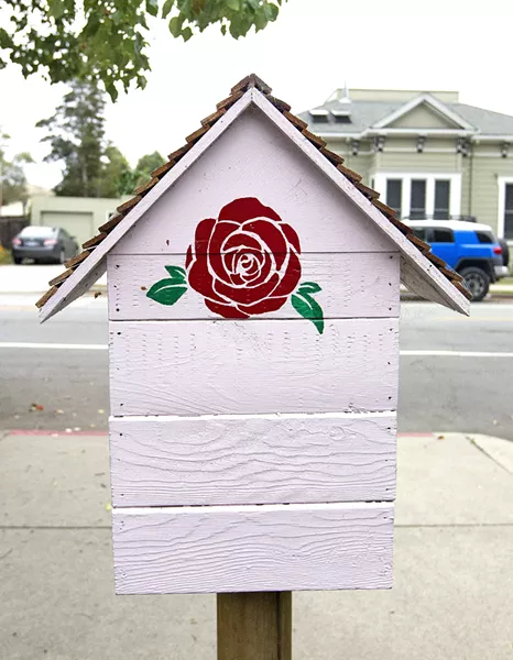 READING RED The Little Free Library in front of SLO Mayor Heidi Harmon's house in the downtown area is stamped with one of her iconic red roses. - PHOTO BY JAYSON MELLOM