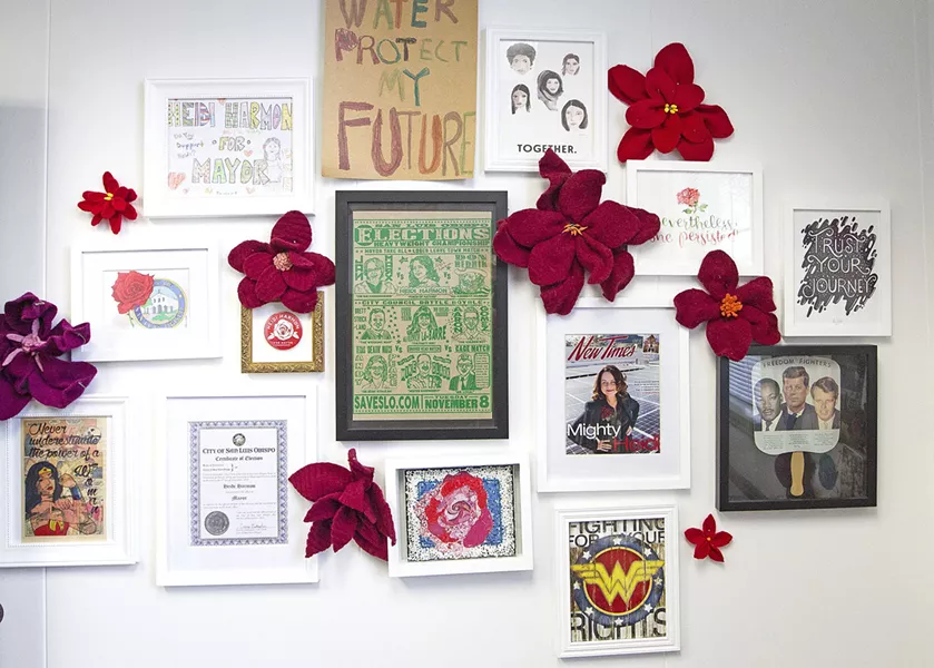 ROSES EVERYWHERE The office of SLO Mayor Heidi Harmon is filled with rose-inspired artwork, many made and gifted by friends. - PHOTO BY JAYSON MELLOM