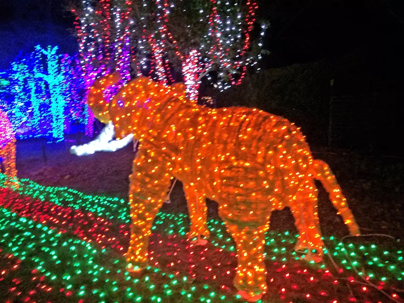 WONDER LAND This neon elephant joins the Snow Queen, Golden Gate Bridge, and more glowing creations at the Cambria Christmas Market. - PHOTO BY RYAH COOLEY