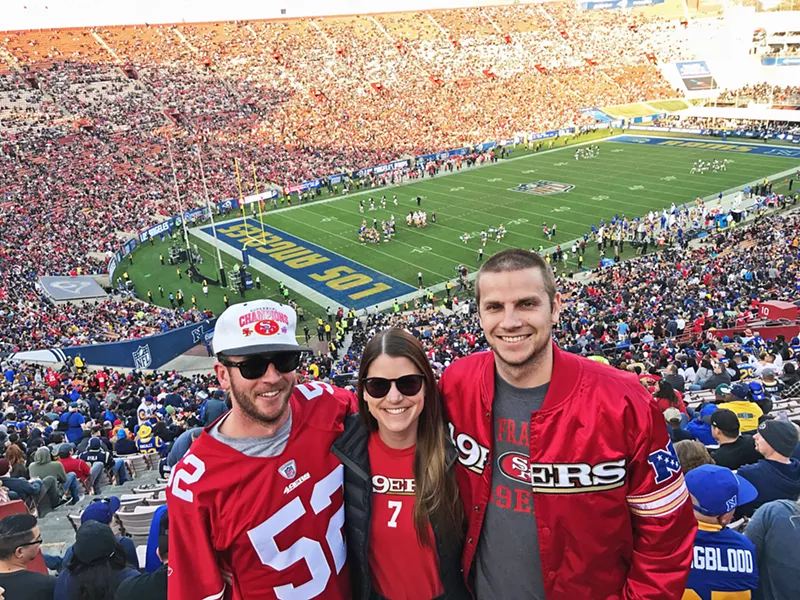 FAMILY TIME My sister, her boyfriend, and I soak in a San Francisco 49ers win against the Los Angeles Rams on New Year's Eve. - PHOTO COURTESY OF PETER JOHNSON