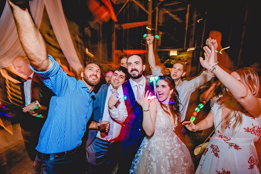 UNIQUE The recent wedding of Naseem and Alex stands out to photographer Blake Andrews for many reasons including that everyone used glow sticks while dancing at night. - PHOTO COURTESY OF BLAKE ANDREWS