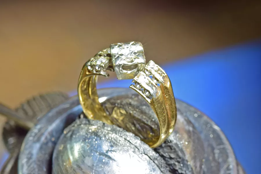 RE-CREATED In order to make something new for a client who came in wanting to combine several family rings, local jewelers and husband-and-wife team David Hillebrecht and Amanda Stephens first had to tear things apart. - PHOTO COURTESY OF GARDEN STREET GOLDSMITHS