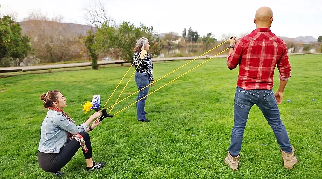 WAR OF ROSES Competitors in the Ultimate Bouquet Toss try to catch the bride's bouquet after it's catapulted from a giant slingshot. - PHOTO COURTESY OF PATRICK ANG