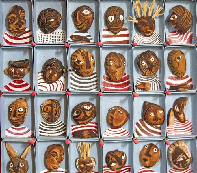 INSPIRATION FROM MEXICO On a trip to Mexico, San Luis Obispo artist M'Lou Mayo stumbled across a piece featuring avocado pits with carved faces and immediately set about creating her own versions, like Avogado Felicidad (pictured) and Avotribe (below). - PHOTO BY JAYSON MELLOM