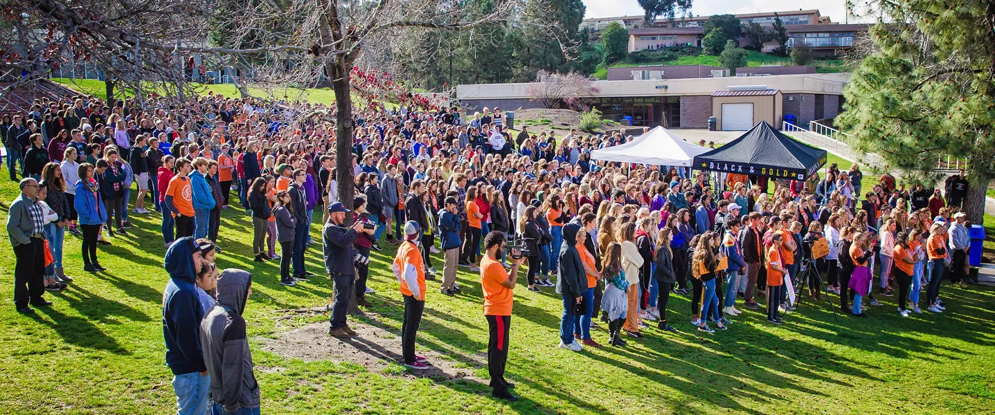 ENOUGH Students gathered on the lawn at San Luis Obispo High School during the March 14 student walkout to protest gun violence on school campuses and honor the 17 victims who were shot in Parkland, Florida, on Feb. 14. - PHOTO BY JAYSON MELLOM