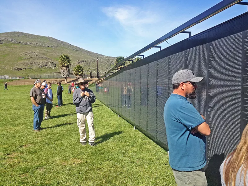THE WALL THAT HEALS A three-quarter-scale traveling replica of the Vietnam Veterans memorial was constructed in Madonna Meadows from March 29 through April 1. - PHOTO BY CHRIS MCGUINNESS