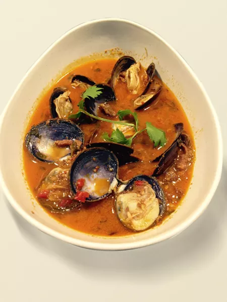 BOWL OF YUM Not sure what to order? Get the clams sautéed with chorizo, onions, jalapeños, tequila, cilantro, and chicken stock. Yes, it's finished with a generous portion of garlic and butter. - PHOTO COURTESY OF LA ESQUINA
