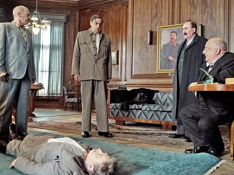 CALL A DOCTOR? After Stalin (Adrian McLoughlin, lying down) falls gravely ill, each member of his power mad inner circle (left to right: Steve Buscemi, Jeffery Tambor, Dermot Crowley, and Simon Russell Beale) plots his next move. - PHOTO COURTESY OF MOVIEWEB.COM