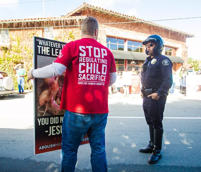 PUSHBACK A local man protests against Planned Parenthood in SLO in February 2017. This year, Planned Parenthood said it could no longer offer health care services at a North County clinic after a nonprofit it partnered with ended the relationship due to receiving "hostile communications" from anti-Planned Parenthood activists. - FILE PHOTO BY JAYSON MELLOM