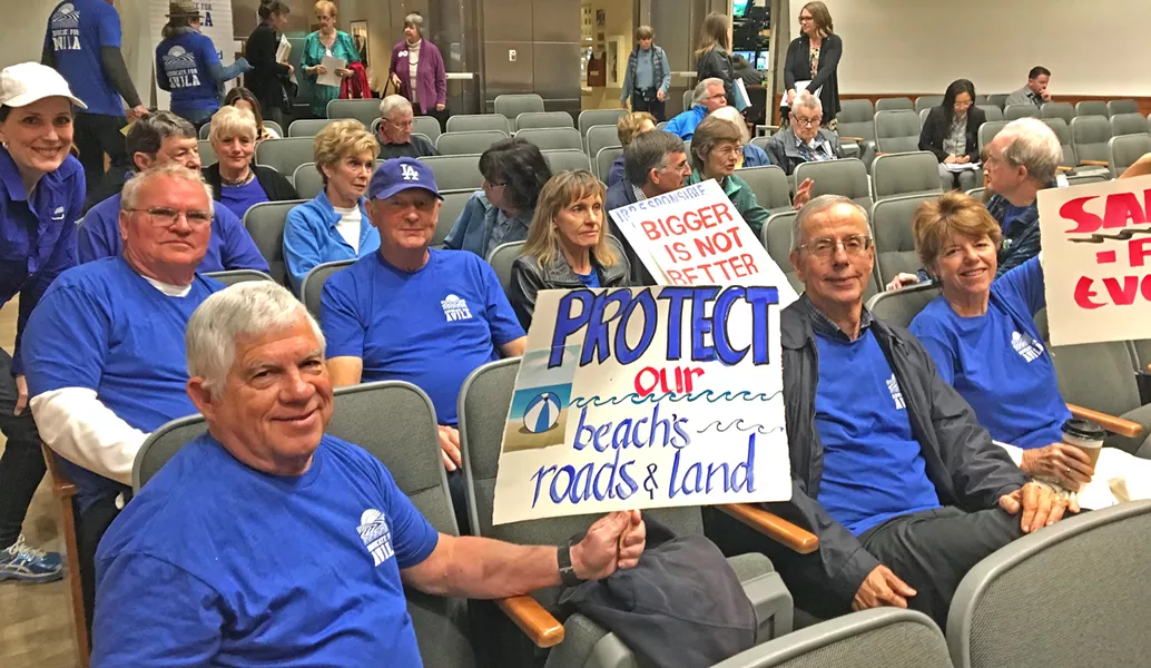 ON THE LOOK OUT Avila Beach residents showed up to the April 17 SLO County Board of Supervisors meeting to voice their disagreement with large development in the area. - PHOTO COURTESY OF BETTY HARTIG