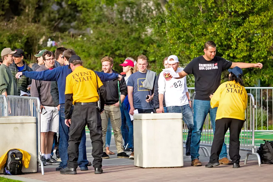 CAMPUS DIVIDED Aside from the line of event attendees, Milo Yiannopoulos' second visit to Cal Poly was quiet. - PHOTO BY JAYSON MELLOM