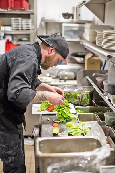 STEAKMASTER Executive Chef Ryan Trimble busies himself with steaks, seafood, and salads at ON Bar in Paso Robles (but, let's be honest, it's mostly steaks). - PHOTO COURTESY OF BY MELISSA MATTSON