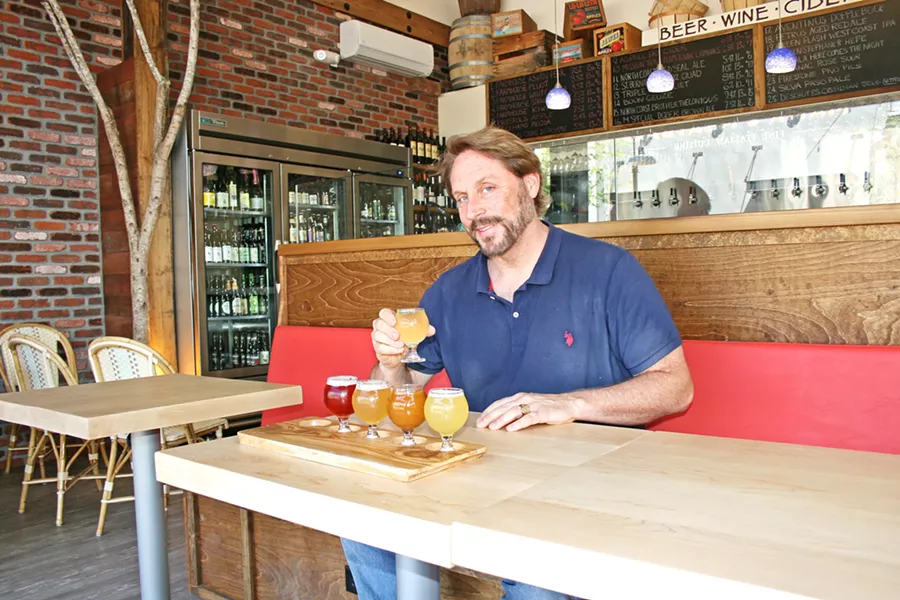 WHERE THE WILD THINGS BAR Cider Bar Owner Kevin Mclaughlin (right) aimed to create a "country French café feel" at his new haunt, located within the SLO Creamery. Here, you can sip from dozens of apple ciders, fruit ciders, beer, and wine options accompanied by small plates like braised short ribs, spicy pickled carrots, and charcuterie imported from Spain and France. - PHOTO BY HAYLEY THOMAS CAIN