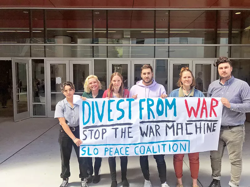 NO PROTESTS ALLOWED Five Cal Poly students are reportedly under investigation for staging a protest against defense contractor Raytheon at a recent campus career fair. - PHOTO COURTESY OF FACEBOOK