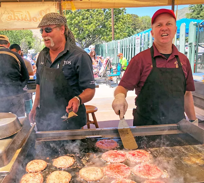 BURGERS, BABY Elks volunteers Jeff and Gary man the poolside grill, dishing up tasty chow. - PHOTO BY GLEN STARKEY