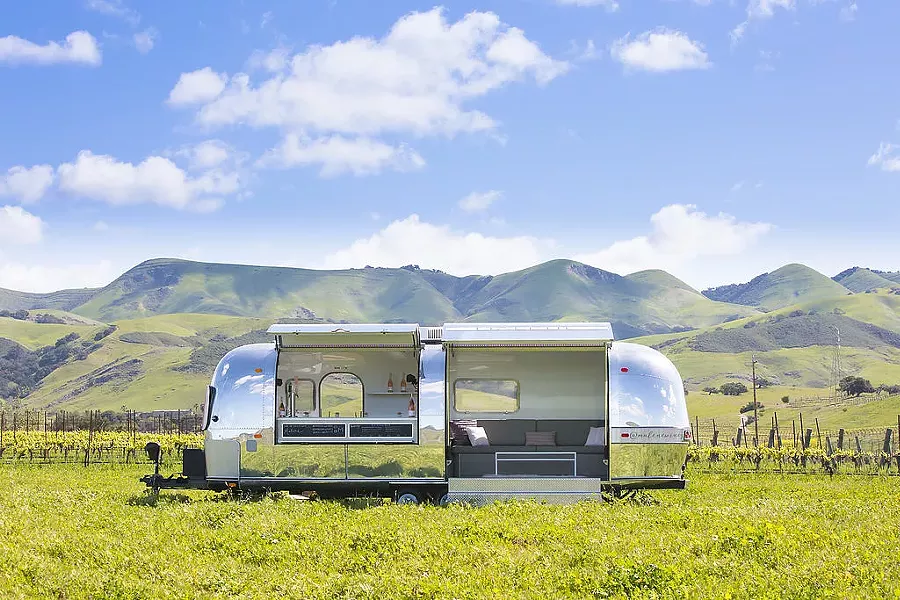 ROSÉ-COLORED GLASSES Just in time for summer, Malene Wines is throwing open the doors of its 1969 Malene Scene Airstream Overlander trailer and inviting one and all to taste elegant and modern rosé releases. Roomier than it looks, this wine tasting room on wheels is large enough to accommodate a tasting bar and cozy enough for good conversation to flow between about a dozen people. - PHOTO COURTESY OF MALENE