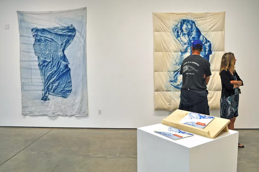 HIDDEN CONNECTIONS One blanket on display is from artist Emily Gui's home; the other two were found at thrift stores. - PHOTO BY ASHLEY LADIN
