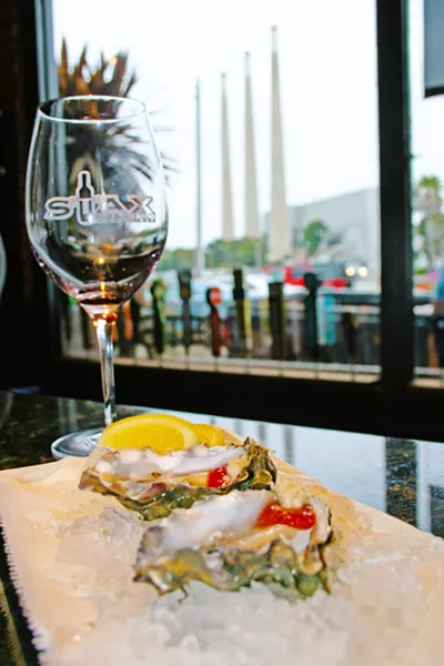 ON THE HALF SHELL Oysters on the half shell, local wine, and a beachy view? This is real life at Stax Wine Bar in Morro Bay. Owned by Giovanni DeGarimore of Giovanni's Fish Market & Galley, Stax is able to offer up fresh seafood whenever a good catch is hauled in from the bay. - PHOTO COURTESY OF REID CAIN