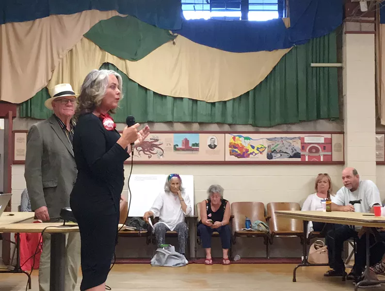 WILL THE REAL PROGRESSIVE PLEASE STAND UP? SLO Mayor Heidi Harmon (right) addresses the SLO County Progressives Democratic Club on July 26, as her election challenger, T. Keith Gurnee (left), watches. The club overwhelmingly endorsed Harmon for mayor, but not before Harmon cut the forum short. - PHOTO BY PETER JOHNSON