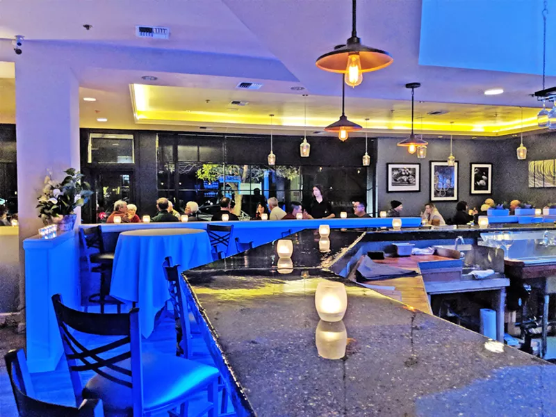 PARK IT HERE Farmstead Kitchen and Catering has transformed the former Panolivo restaurant into a whole new animal. At night, the dining room glows blue. By day, lunch is served on the sunny Park Street patio. - PHOTO BY HAYLEY THOMAS CAIN