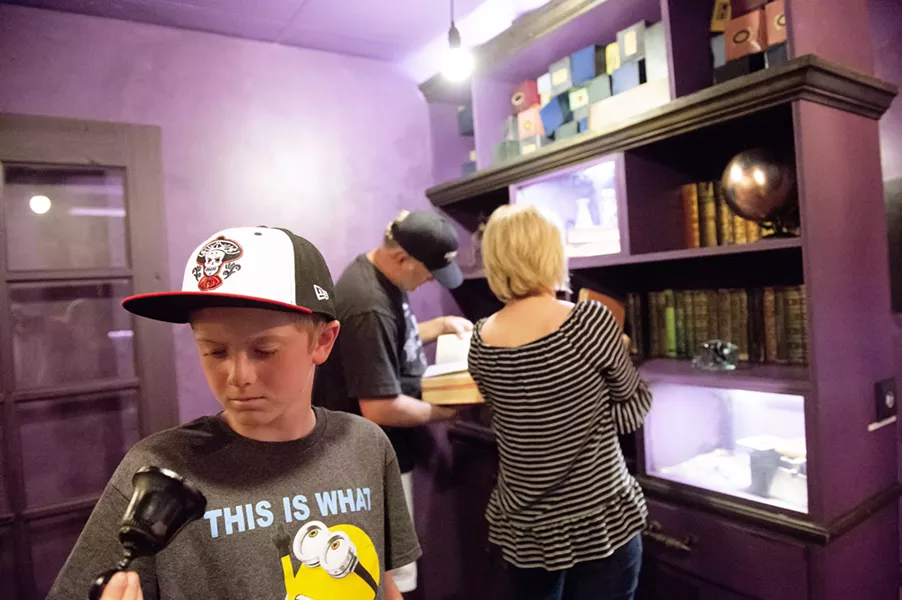 FAMILY FUN Time for family bonding or a work event? Book the magical library Grim Stacks at The Puzzle Effect. - PHOTO COURTESY OF THE PUZZLE EFFECT