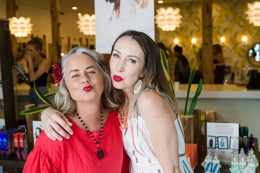 PUCKER UP Ariel Shannon (right) created Mighty Lips lipstick and teamed up with Mayor Heidi Harmon (left) to produce the first shade. Going forward, Shannon plans to create other lipstick colors under the line inspired by influential women like Michelle Obama, Ruth Bader Ginsberg, and Oprah Winfrey. - PHOTO BY JAYSON MELLOM