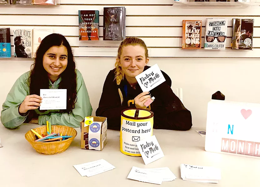 SPREADING KINDNESS SLO High School REACH Club members Malia Cariño (left) and Sabrina Marks (right) hold up "kindness cards," which were individually crafted and distributed to 700 peers, staff, and teachers last March. - PHOTO COURTESY OF ANA O'SULLIVAN