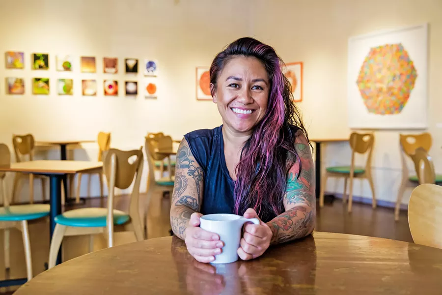 A FRESH SPACE, SAME FACES Longtime manager Kalae Neves and many of the baristas behind the counter have stayed on as Steynberg Gallery has transitioned to The 4 Cats Café and Gallery. - PHOTO BY JAYSOM MELLOM