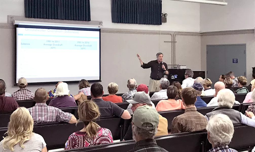 SETTING LEVELS Hydrologist Derrik Williams briefed several dozen Creston landowners on the area's groundwater conditions at an Oct. 8 workshop in Creston Elementary School. - PHOTO BY PETER JOHNSON