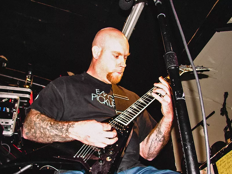SHREDDER Known for his technical proficiency, Erik R. Lindmark (pictured) also fronted local metal band Charlie Christ. Two other local metal bands—Cryptolith and Stone Mountain—will play his celebration of life on Dec. 20, in Sweet Springs Saloon. - PHOTO COURTESY OF GISELE KINGSTON