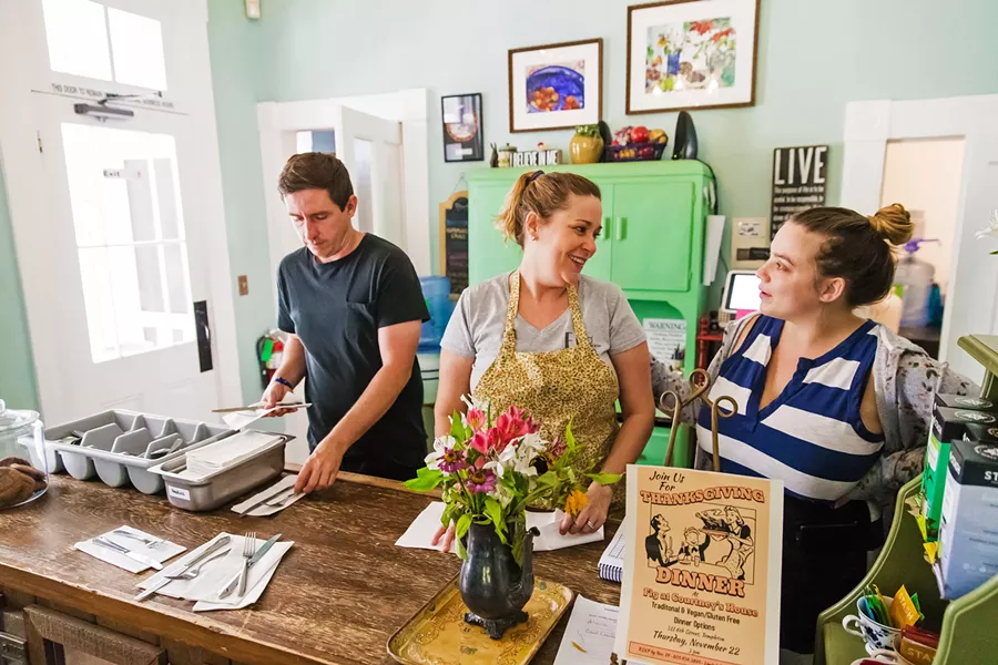 INCLUSIVE WORK Juston Saylor, Erin Babcock, and Megan Toohey (left to right) prepare napkins and silverware for customers at Fig at Courtney's House. The 3-year-old nonprofit in Templeton provides restaurant job training, employment, and community to adults with developmental disabilities. - PHOTO BY JAYSON MELLOM