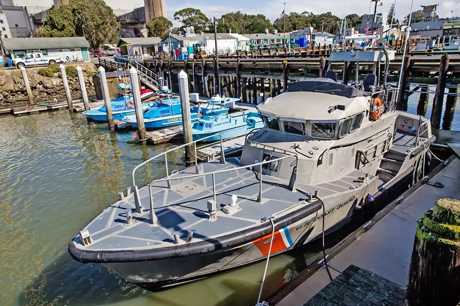 NO PAY Members of the U.S. Coast Guard work on a boat near the Morro Bay station. Coast Guard members were just some of the more than 800,000 workers who were furloughed or forced to work without pay during the shutdown. - PHOTO BY JAYSON MELLOM
