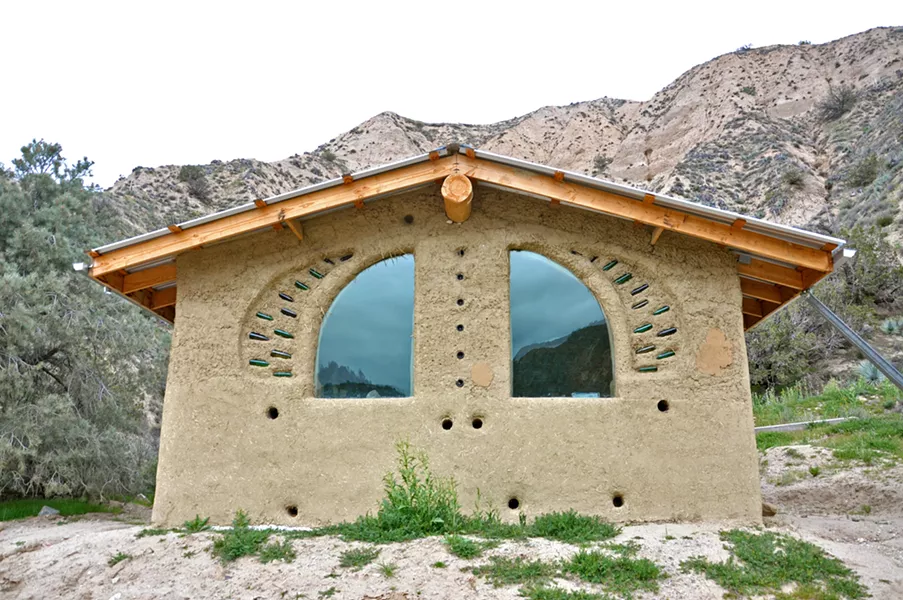 THE CATHEDRAL Although it's unfinished on the outside, this cob structure is a music area for Quail Springs staff members to come practice, play music, and sing. - PHOTOS BY CAMILLIA LANHAM