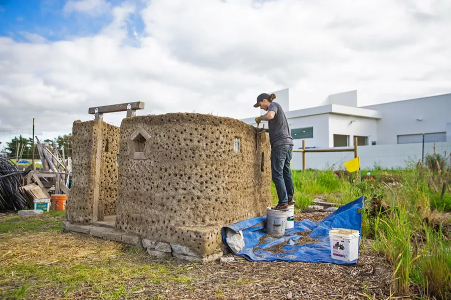 LABOR OF LOVE Although cob building is labor intensive, Franco said there's something about working with your hands from found materials that makes it all worth it. - PHOTO BY JAYSON MELLOM