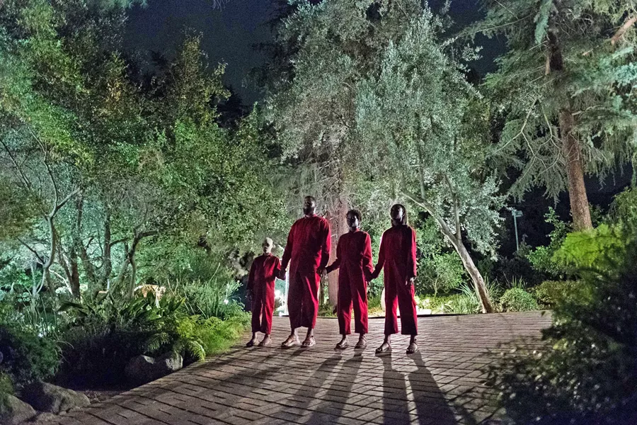 HANDS ACROSS AMERICA Evil doppelgängers menace a family in writer-director Jordan Peele's new film Us, but like his debut Get Out, this film has more on its mind than mere horror. - PHOTO COURTESY OF MONKEYPAW PRODUCTIONS