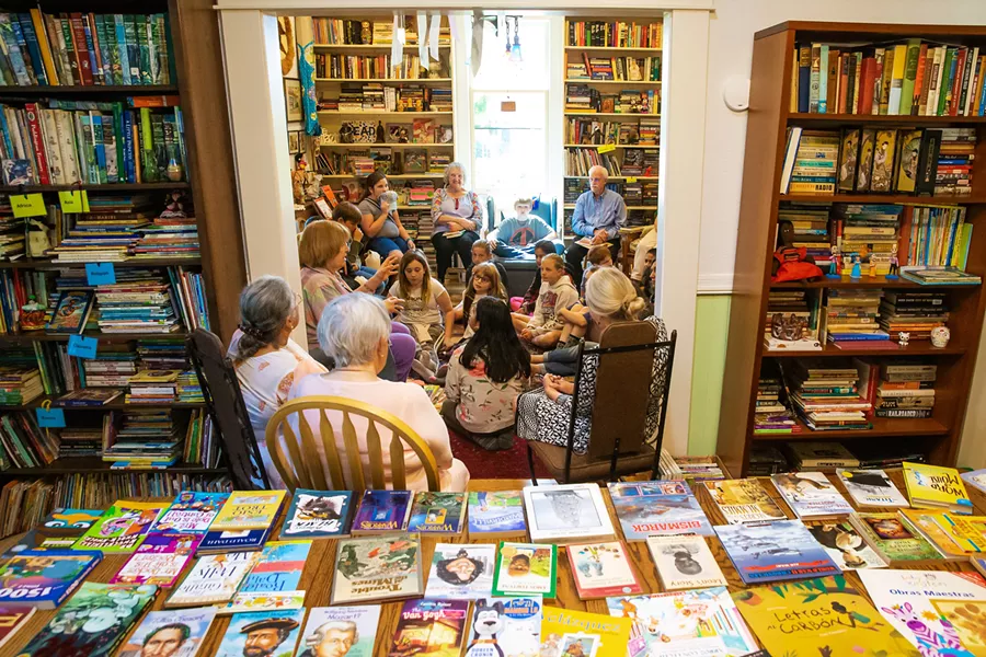 GIFTING BOOKS Liz Krieger has opened her home to schools, teachers, and, most importantly, students in order to give away donated books. - PHOTOS BY JAYSON MELLOM