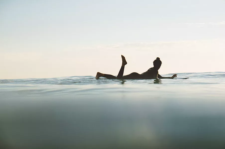 UP CLOSE While catching someone shredding a gnarly wave is all well and good, local photographer and surfer Colin Nearman prefers to capture those quiet little moments, like a lone surfer bobbing along the waves after a day spent surfing. - PHOTOS COURTESY OF COLIN NEARMAN