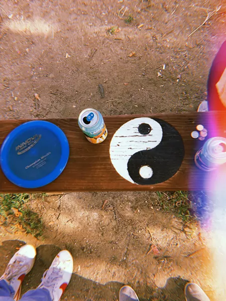 COMPLEMENTARY Some of the starting markers at the disc golf course at Sinsheimer Park had benches with peaceful art on them. - PHOTOS BY KAREN GARCIA