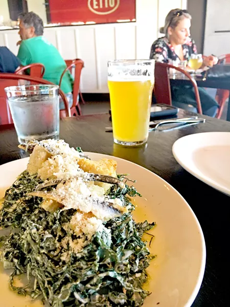 FARM-TO-TABLE FARE Walking into the Tin Canteen, you are greeted with the lovely aroma of wood-fired pizzas, rich Wagyu meatballs, herbs, and garlic. Pictured is the kale Caesar with boquerones for the table. - PHOTOS BY BETH GIUFFRE