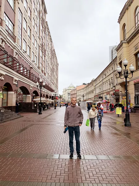 EXPLORING Here I am on Arbat Street, a long cobblestone pedestrian alley, home to shops, artists, and cafes. - PHOTO COURTESY OF PETER JOHNSON