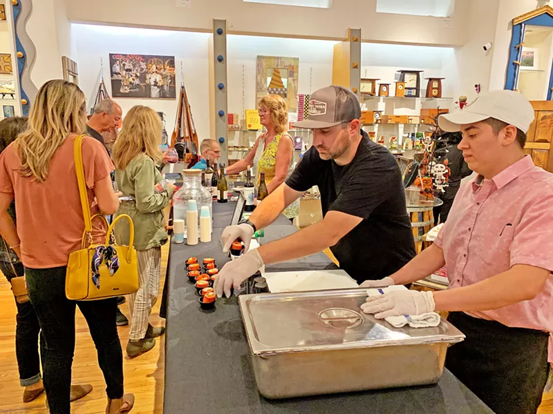 MORE PLEASE Hands Gallery had a beautiful selection of hand-crafted goods, from jewelry to clocks, to look at while munching on wraps served by Mother's Tavern. - PHOTO BY CAMILLIA LANHAM