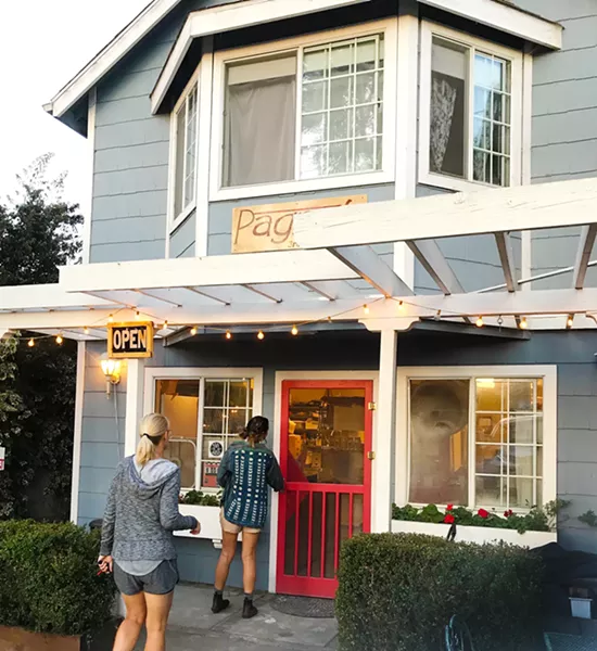FIRST CUSTOMERS Just as the sun rises above the cypress trees in the Baywood Park neighborhood of Los Osos, two early birds walk into Pagnol to the welcoming scent of Marcus Marren's fresh-baked bread. - PHOTOS BY BETH GIUFFRE