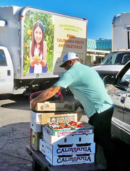 GETTING THE WORD OUT Did you know San Luis Coastal Unified School District serves local fruits, vegetables, meat, and fish? Thanks to Slow Money's FarmSLO program, local children will be able to fill their lunch trays with sustainable nutrition and goodness. - PHOTO BY BETH GIUFFRE