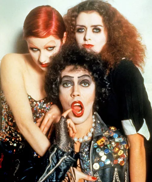DO THE TIME WARP AGAIN Dr. Frank-N-Furter (Tim Curry, center), his groupie Columbia (Nell Campbell, left), and his domestic Magenta (Patricia Quinn) have a mad, sexy time in the cult classick, The Rocky Horror Picture Show, screening at the SLO Brew Rock Event Center and Downtown Centre. - PHOTO COURTESY OF TWENTIETH CENTURY FOX