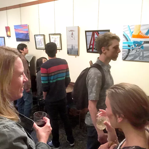 CAFé MEETS GALLERY Art After Dark attendees sip wine and enjoy a group show at Linnaea's Cafe. Owner Marianne Orme said she moves tables and provides an artist reception to turn her café into an art-focused space during this monthly event. - PHOTO COURTESY OF MARIANNE ORME