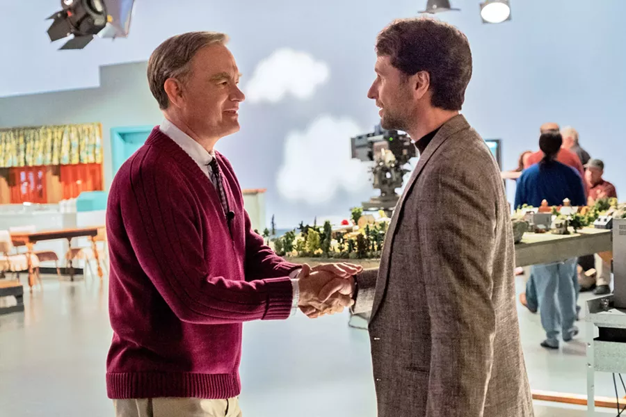 LOOK FOR THE HELPERS Beloved children's television host Mr. Rogers (Tom Hanks, left) teaches cynical journalist Lloyd Vogel (Matthew Rhys) the meaning of compassion and forgiveness, in A Beautiful Day in the Neighborhood. - PHOTO COURTESY OF TRISTAR PICTURES